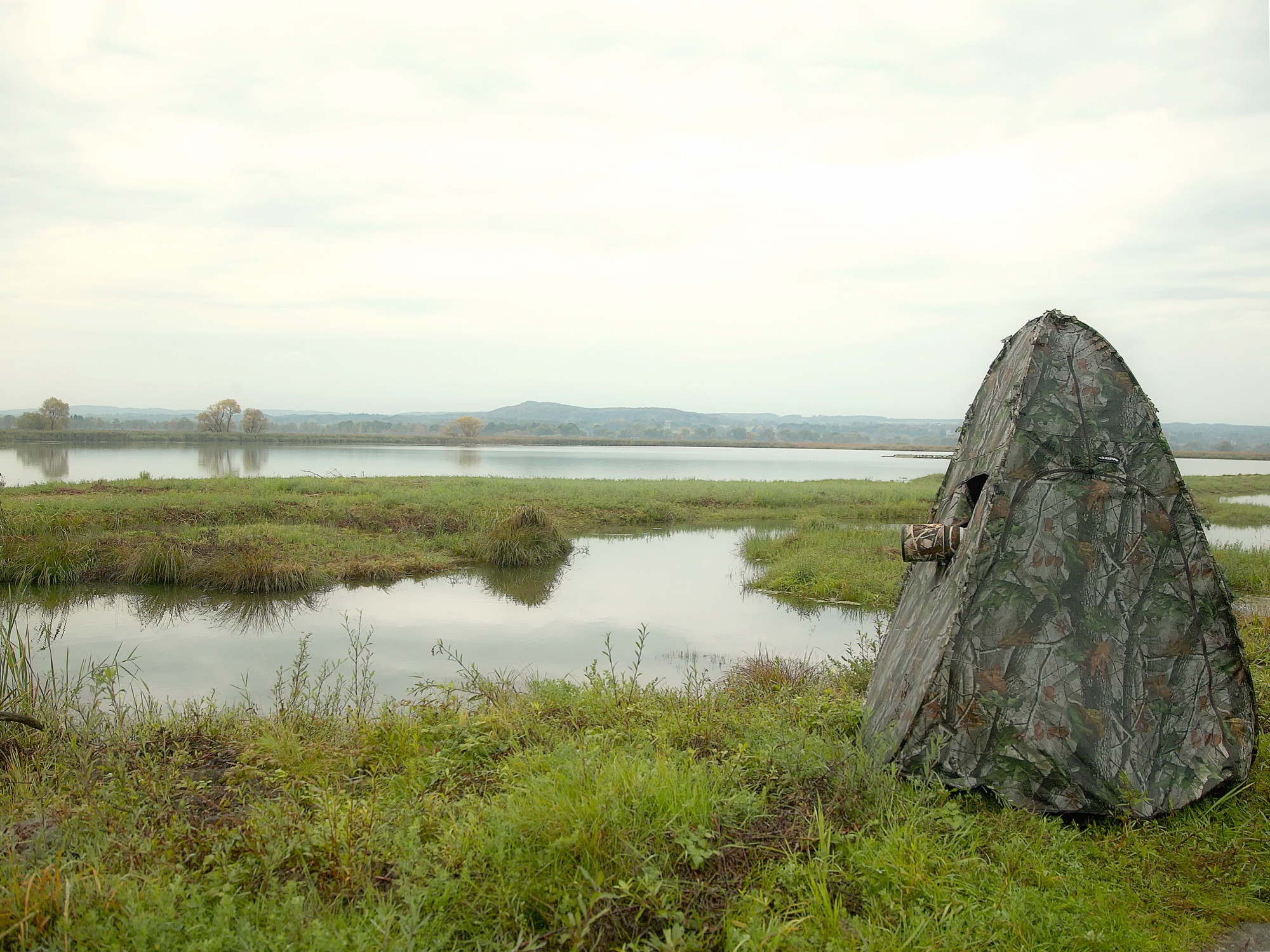 in the camouflage tent